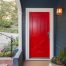image of a front door painted red to show how to improve curb appeal on a budget