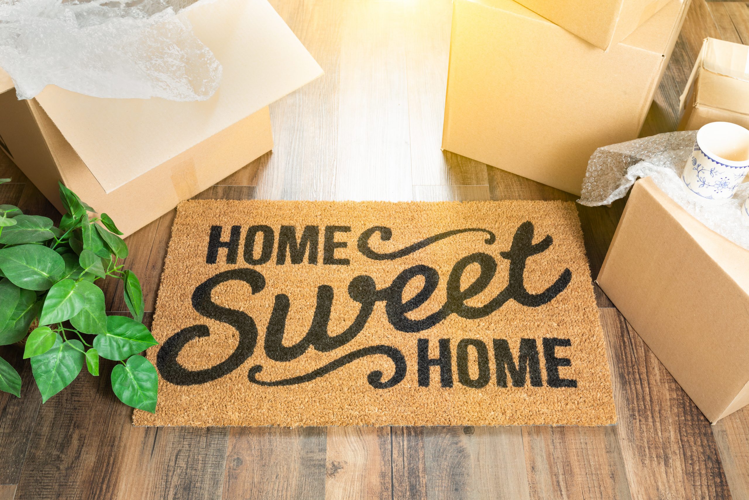 image of a doormat that says home sweet home, to help illustrate how to move stress free