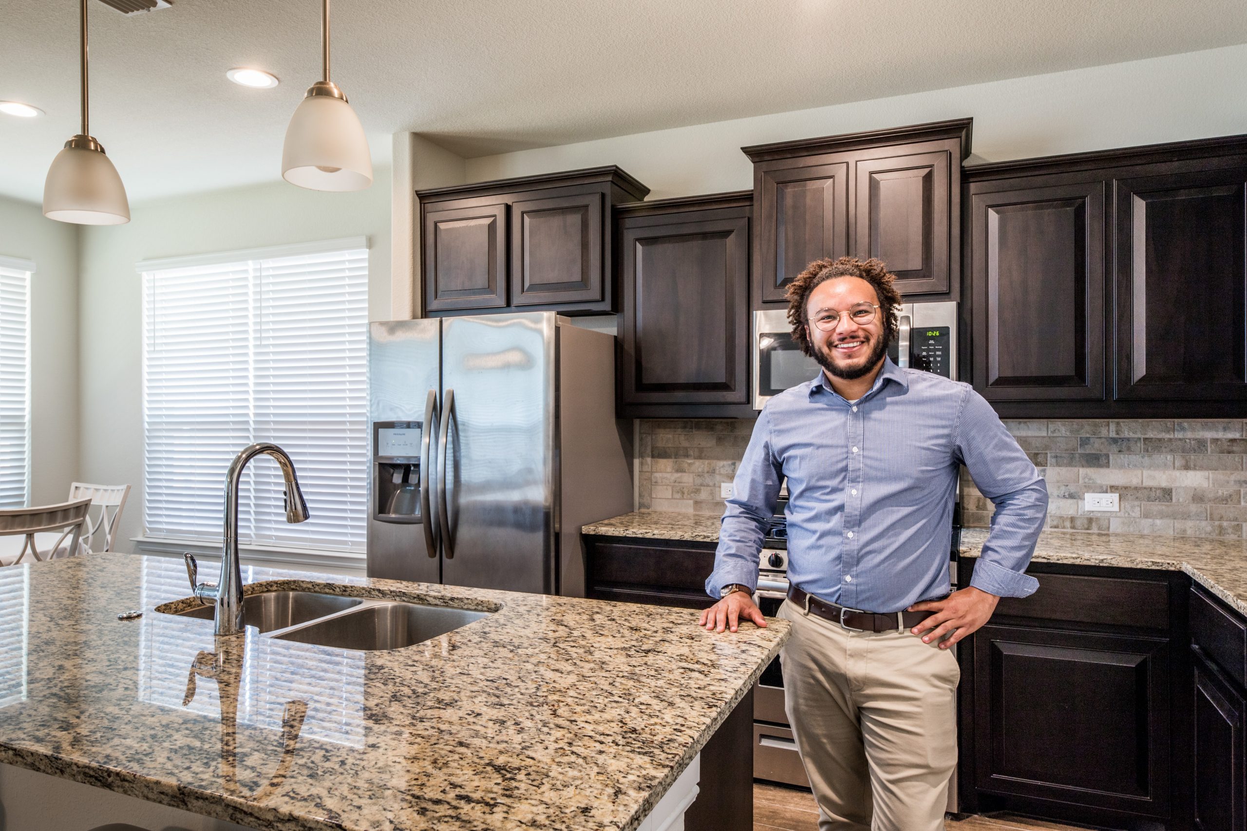 real estate agent standing in kitchen