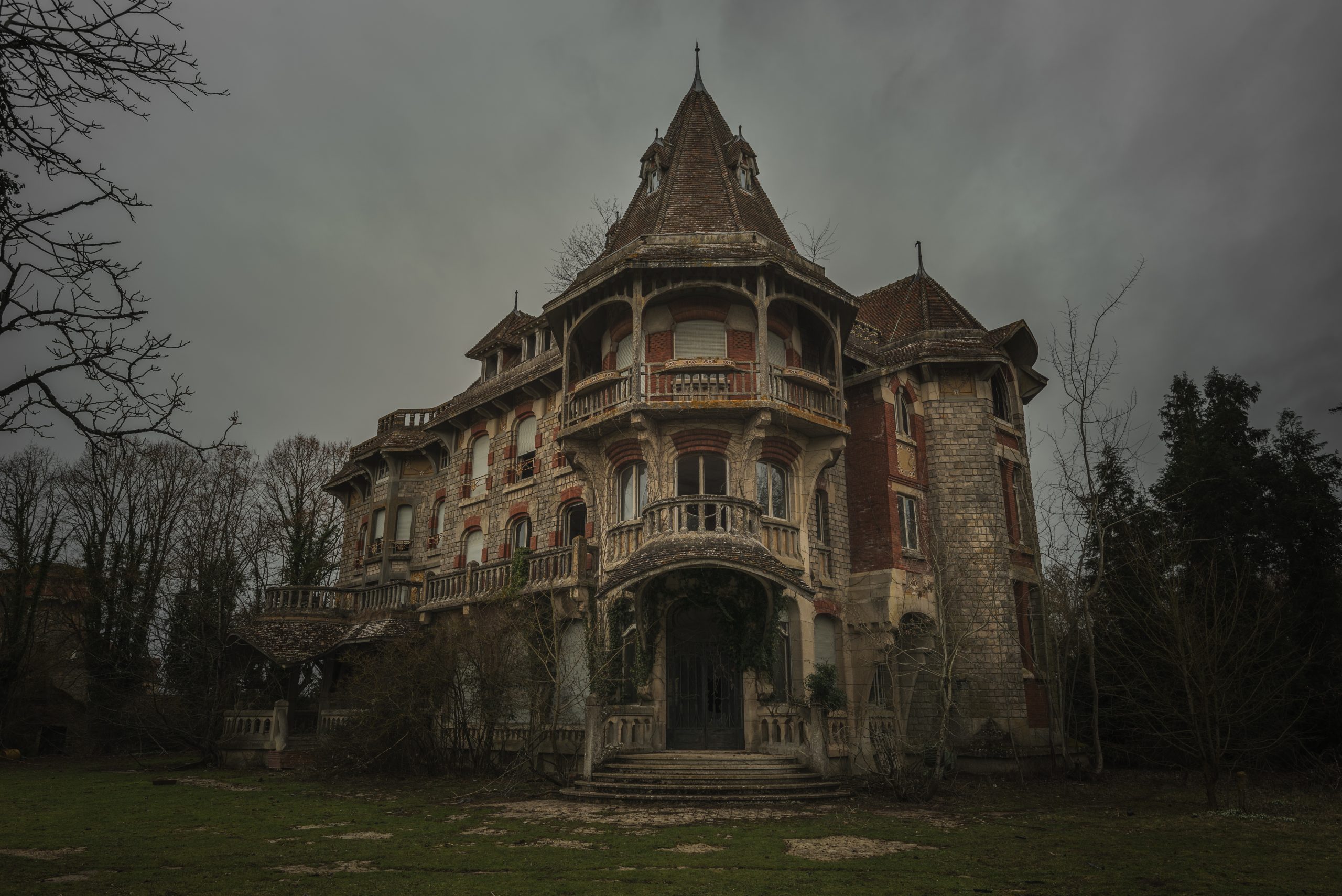 Looking up at dark scary haunted house