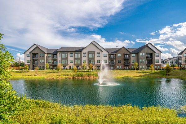 photo of a pond with a water fountain at a multi-family property