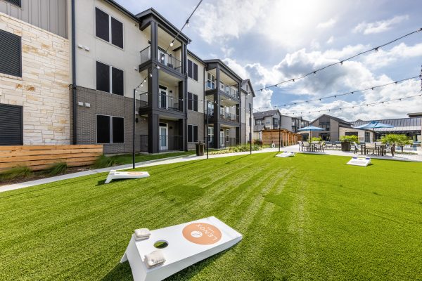 staged exterior games area of a multi-family property