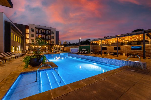 twilight view of the pool at a multi-family property