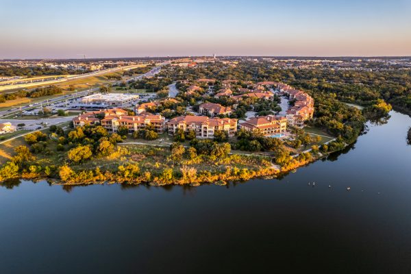 drone view of natural water features around a multi-family property