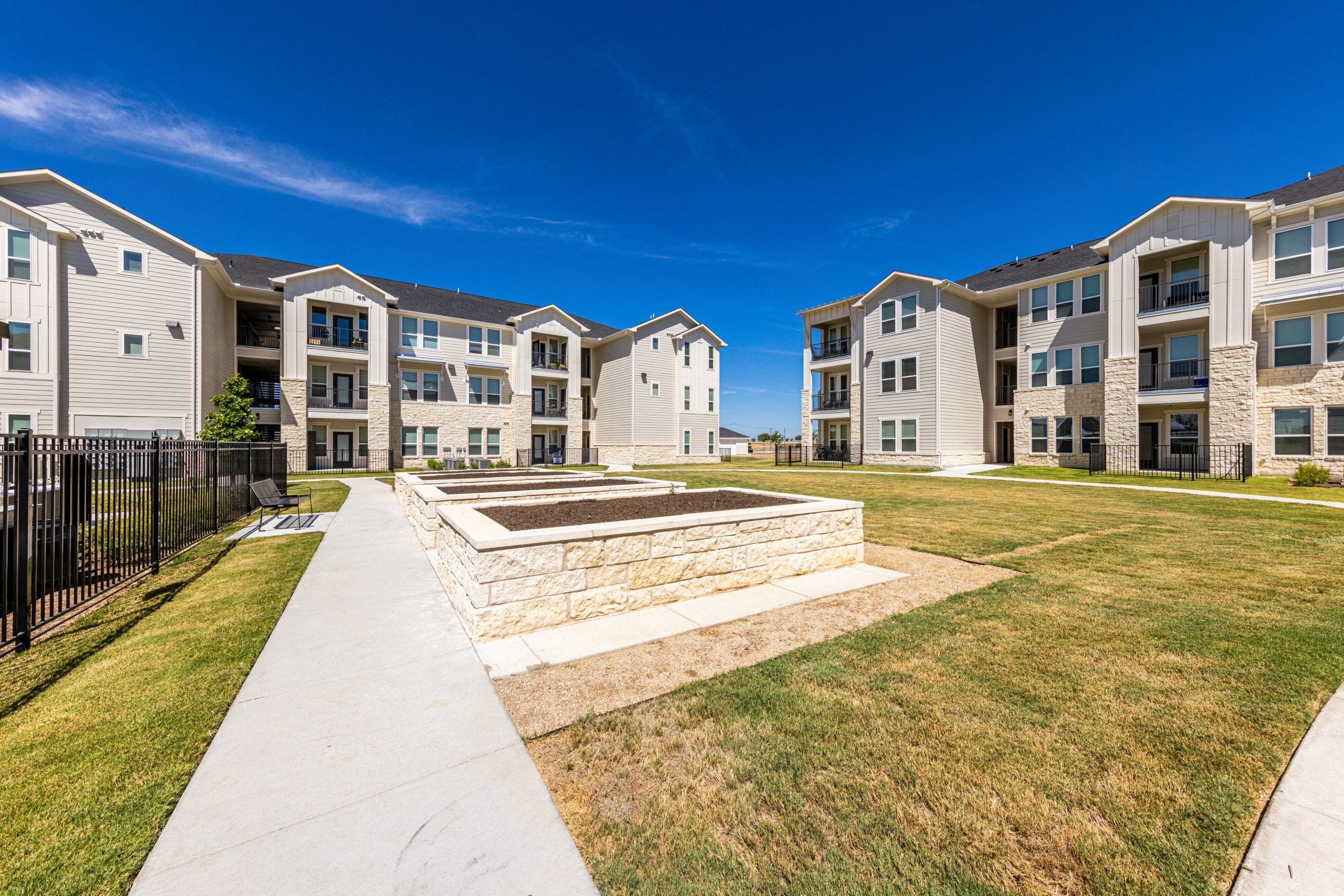 daytime view of the grounds of a multi-family commercial property