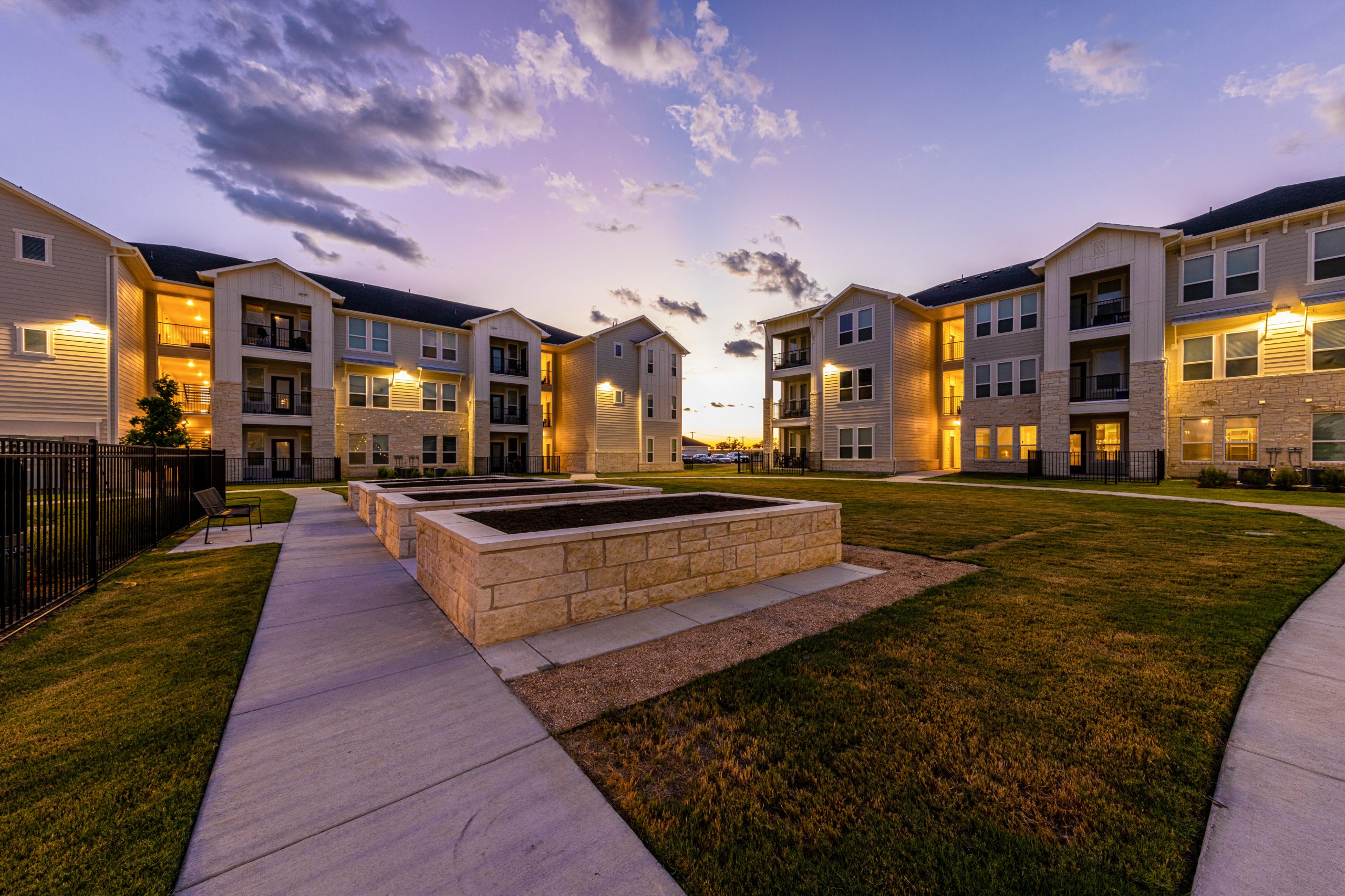 twilight view of the grounds of a multi-family commercial property