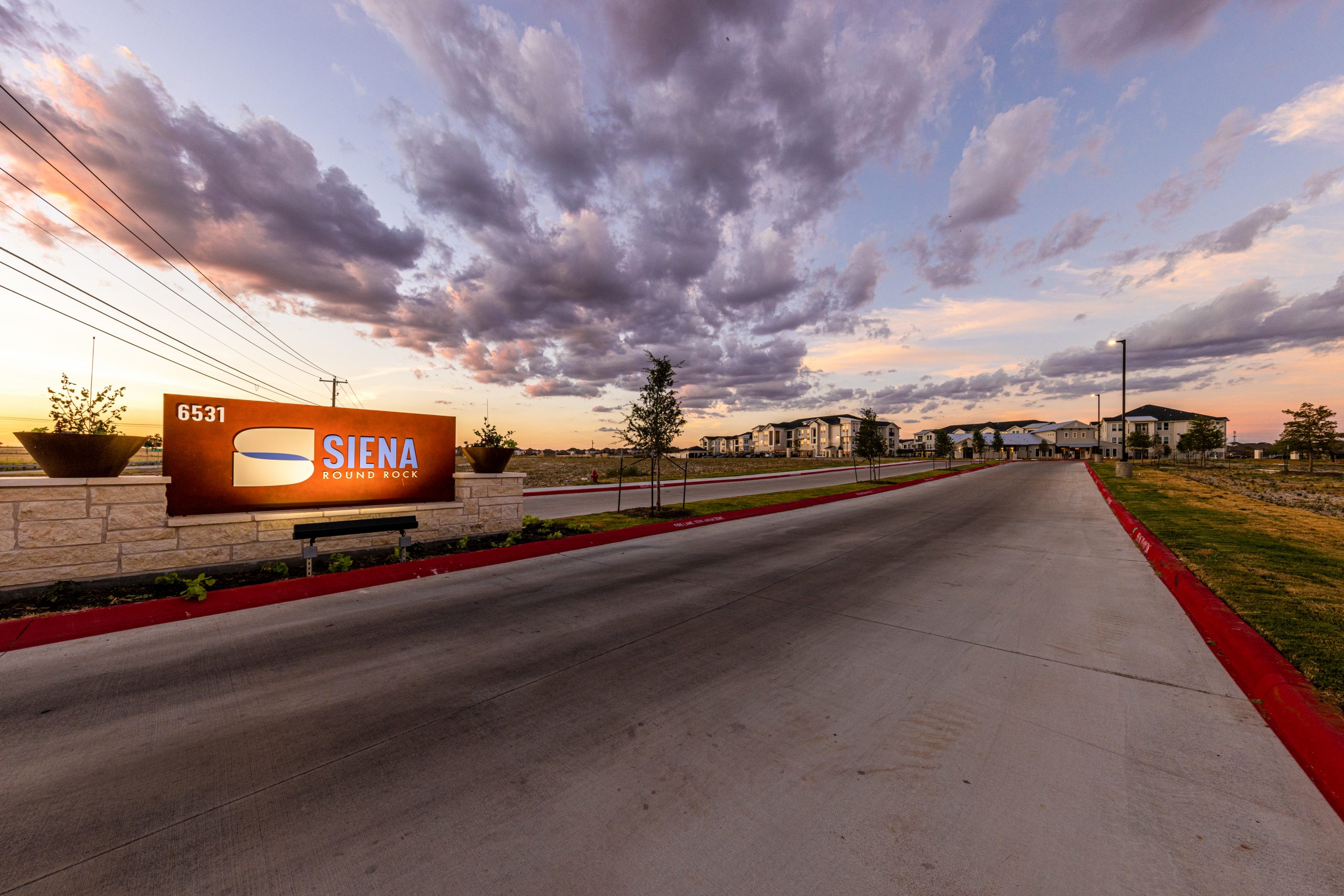 commercial real estate photos - multifamily property entrance in twilight