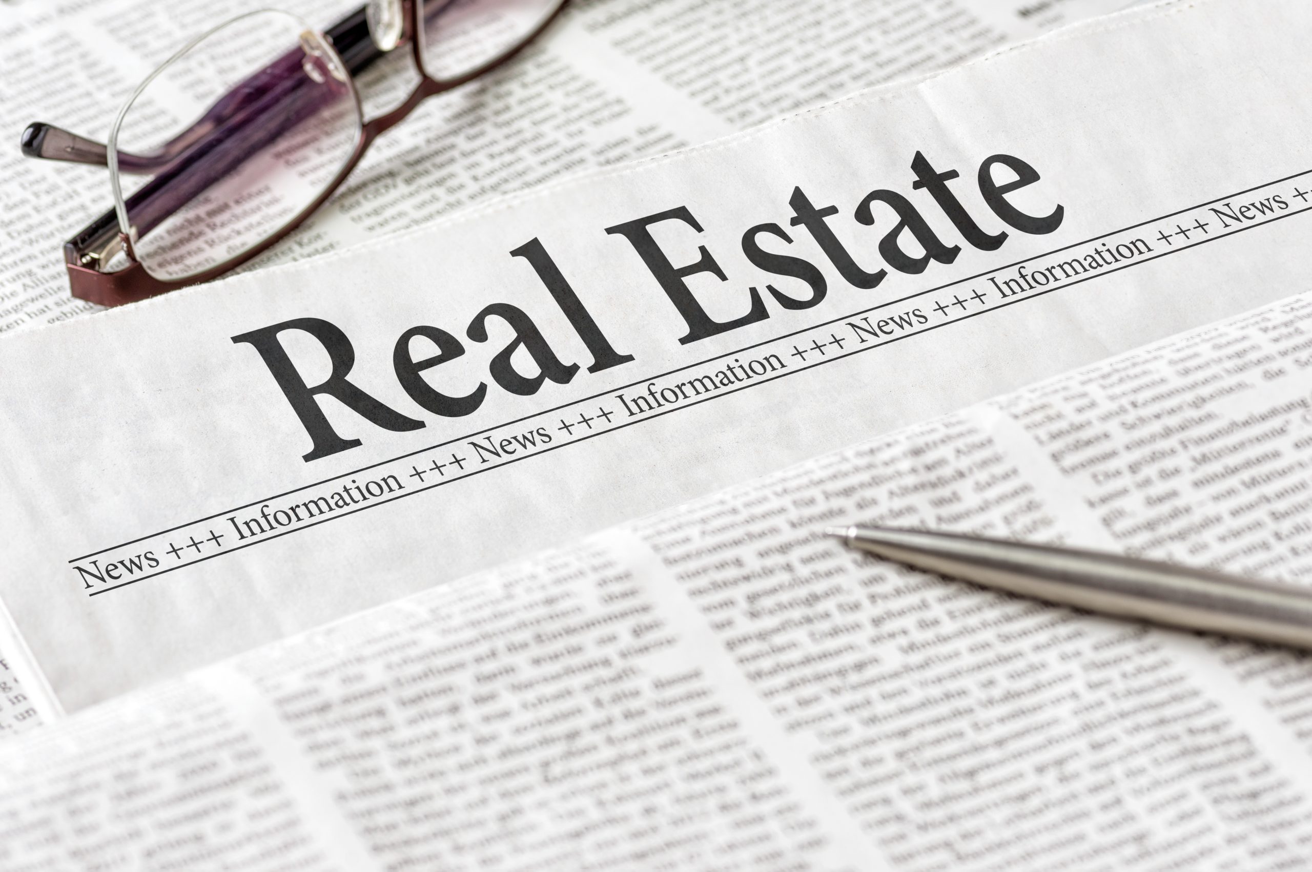 image of a newspaper where the headline reads, "real estate"