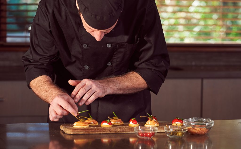 Open house tips: image of a private chef preparing canapes for an event