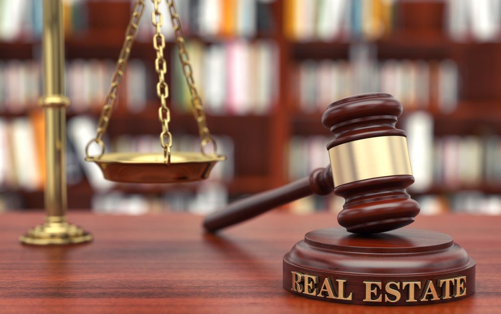scales and a gavel to represent a residential real estate attorney