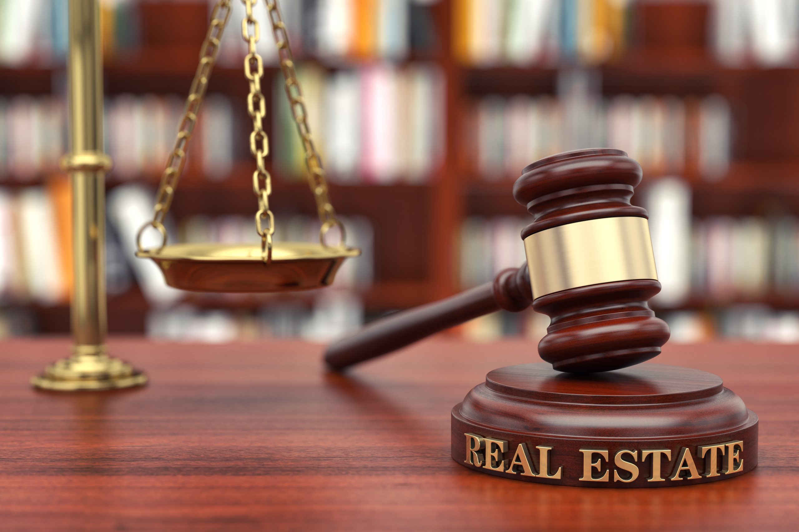 scales and a gavel to represent a residential real estate attorney