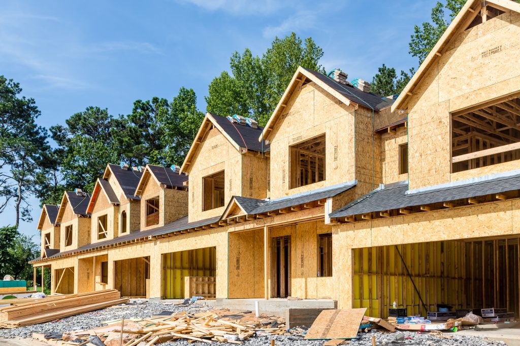 a row of new construction homes being developed