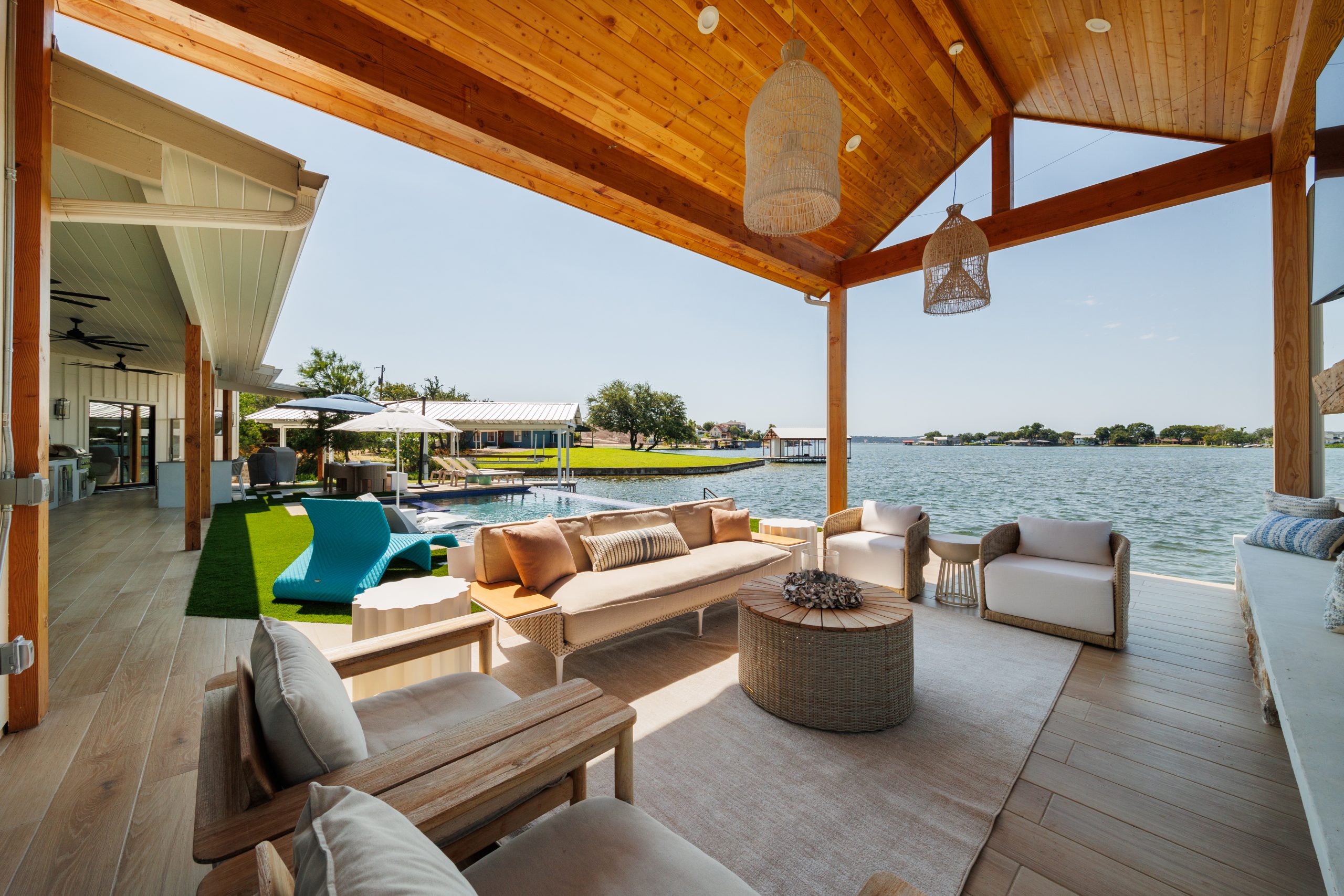 Lakeside Retreat - image of a shaded living space on a deck overlooking lake views