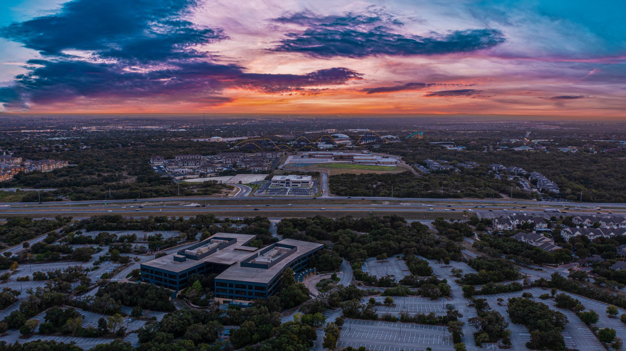 Sunset Over San Antonio - beautiful panoramic sunset over a commercial property adjacent to a major highway