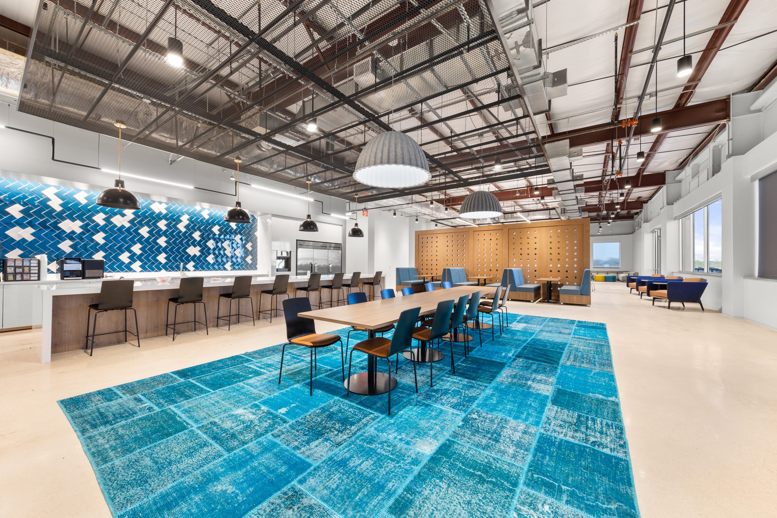 Open Office Community Space with a buffet island, communal work tables, and printer station