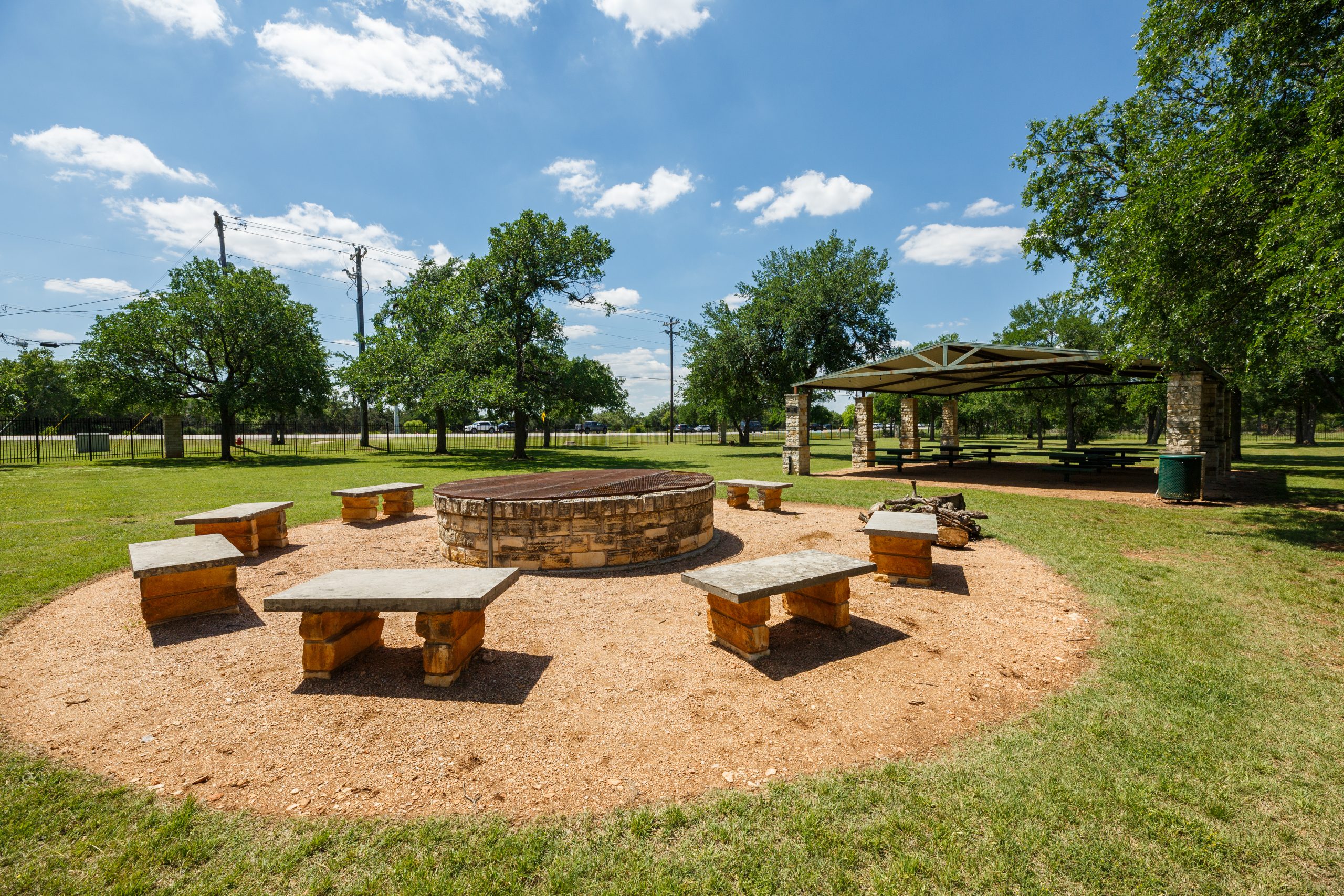 Square Foot Photography, community gathering space with circular bench seating and covered dining tables