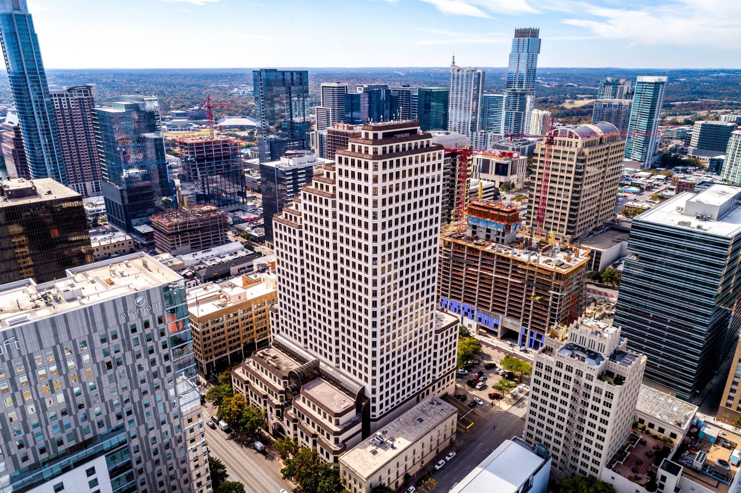 Square Foot Photography Hero Shot Example, commercial property with a drone view of surrounding downtown area