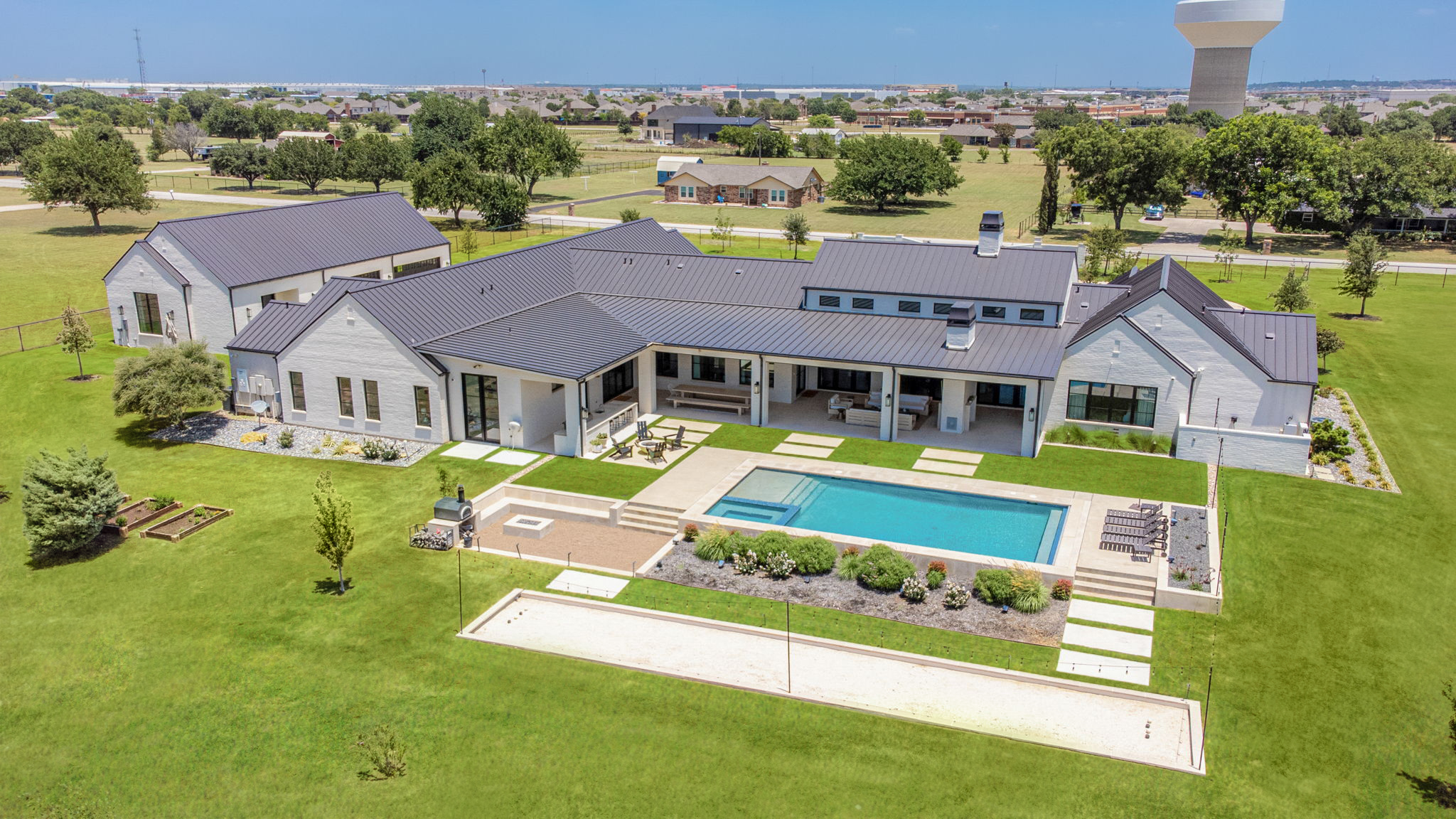 Best Time of Year to Take Photos; aerial image of a residential home in summer