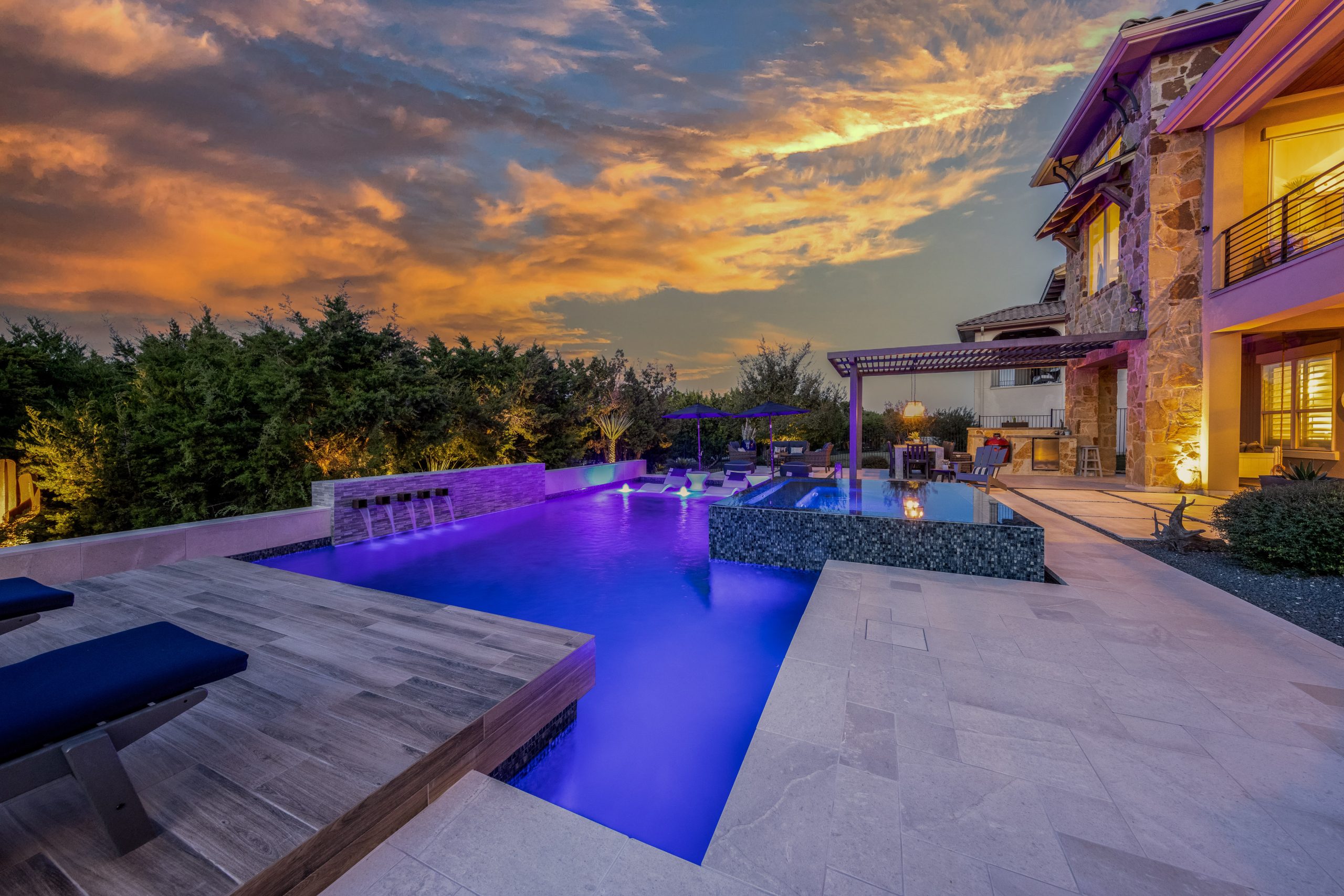 Twilight Image of residential home backyard with pool at sunset