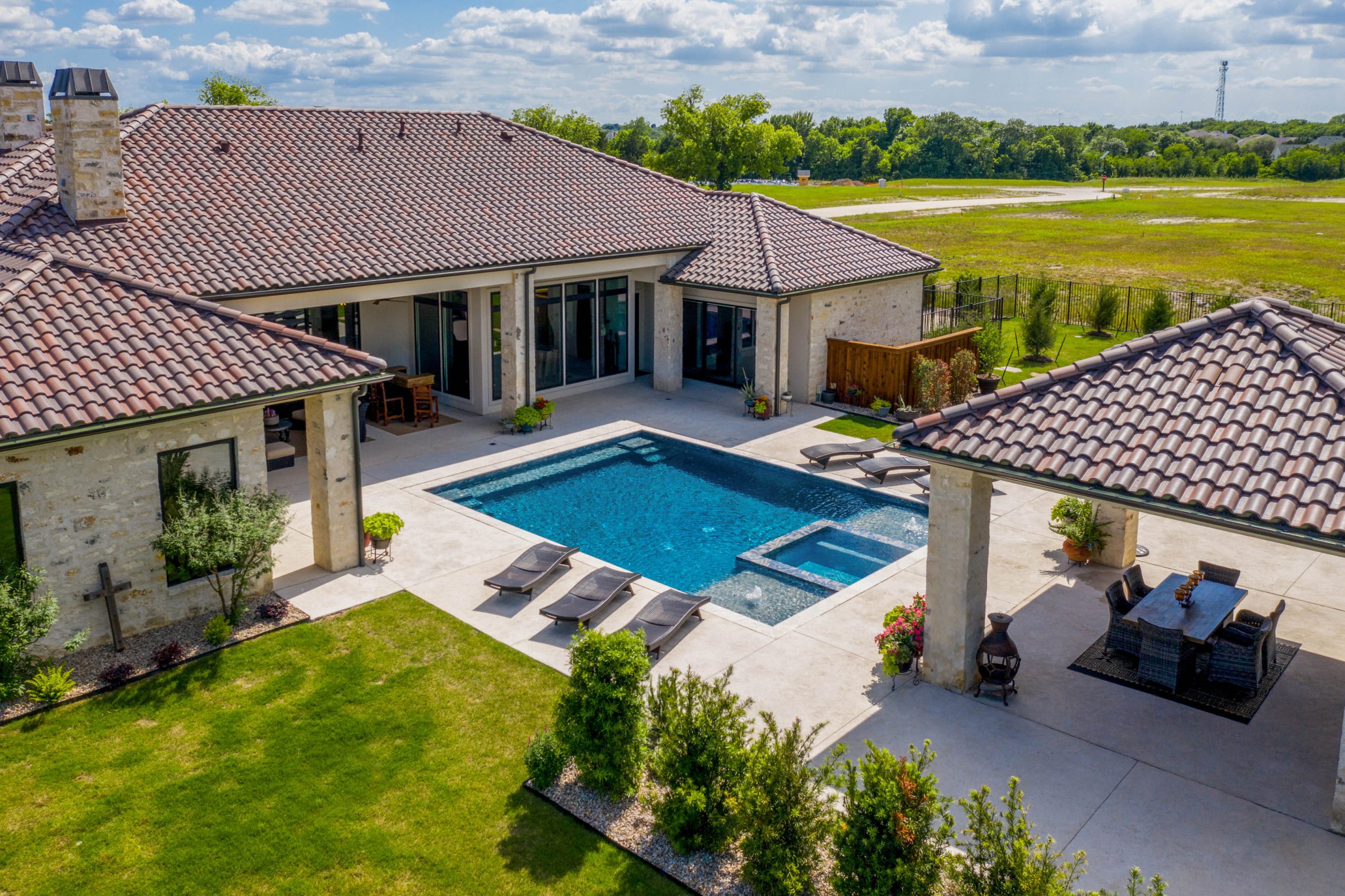 SQFTa-0569-scaled residential drone photography - top down of a backyard pool and patios