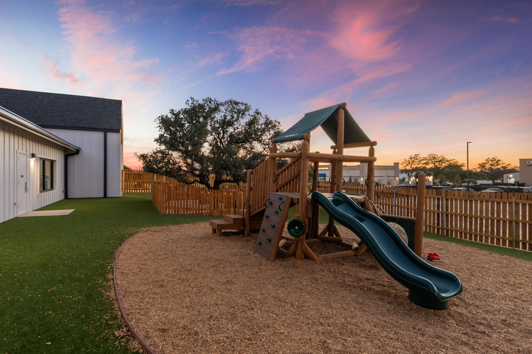 Mrs. Amy's Preschool - playground, twilight view