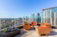 high-rise listing marketing for high-rise residential building; outdoor lounge with skyline views