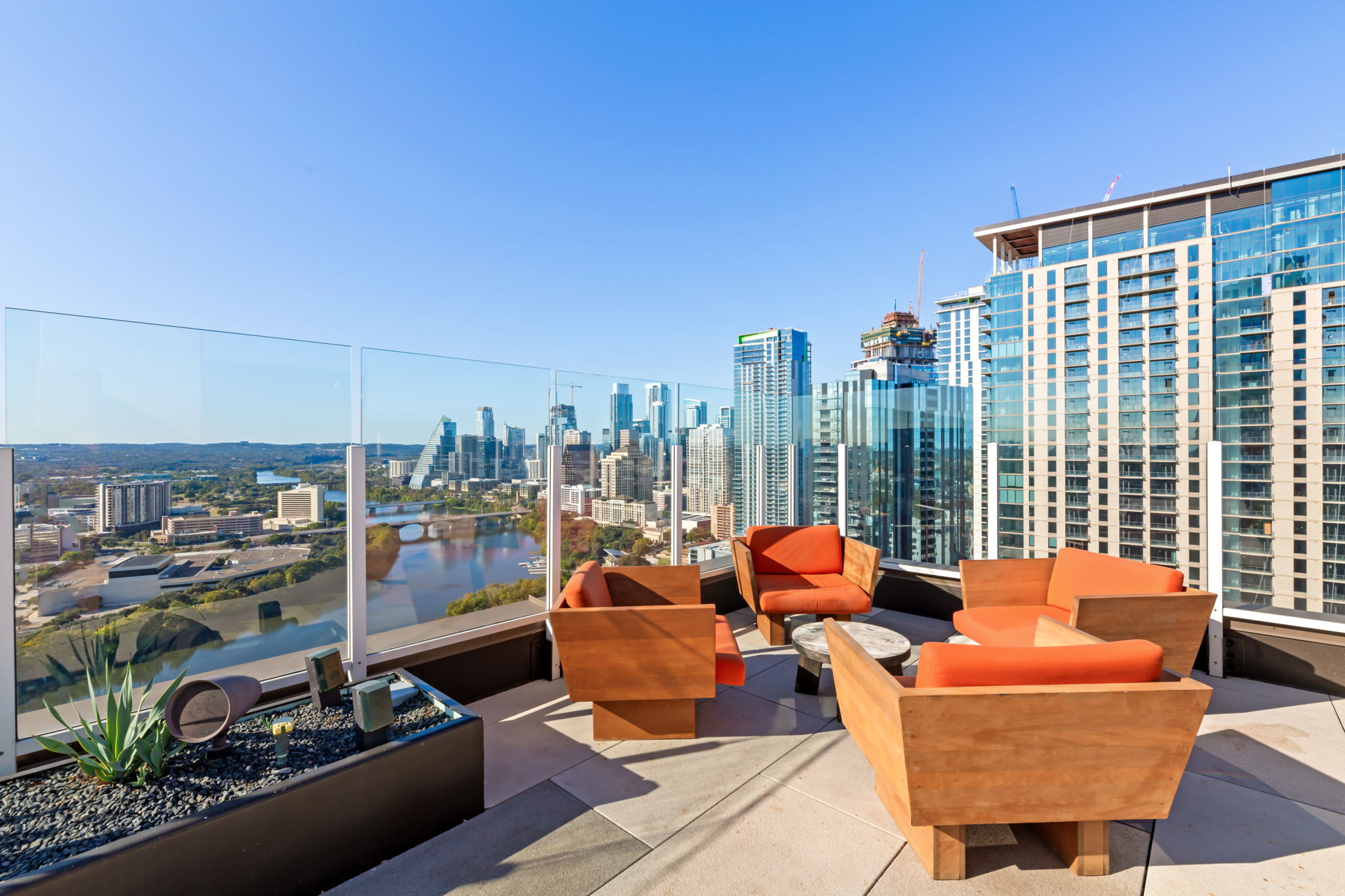 high-rise listing marketing for high-rise residential building; outdoor lounge with skyline views